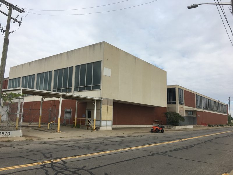 Present-day street-level view of the engineering building's modernist corner volume on Scotten Street